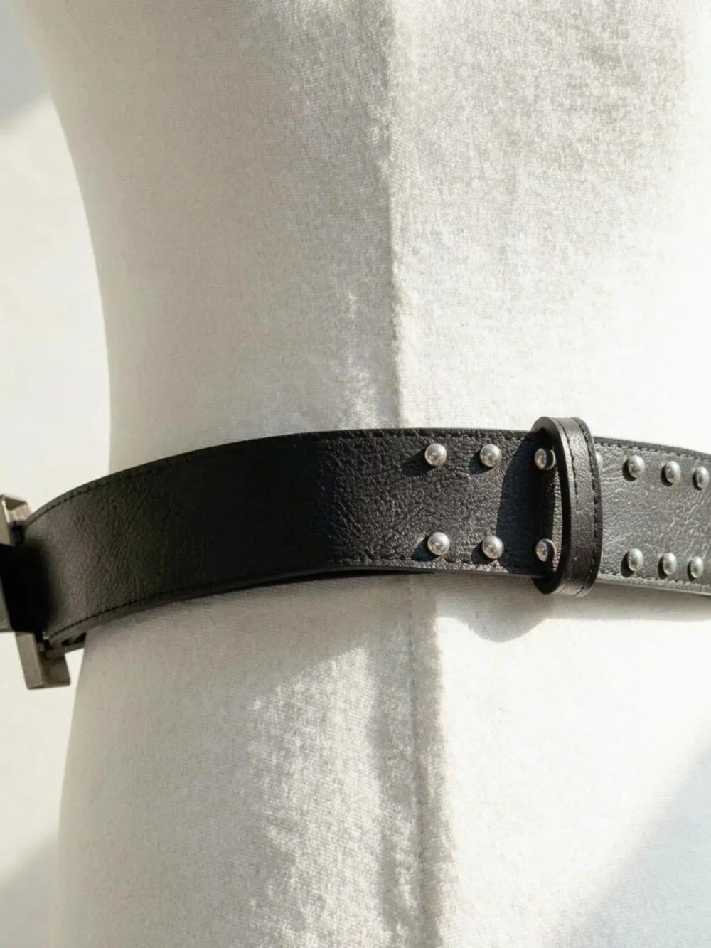 Y2K 2000s style Black leather studded cross belt with silver hardware